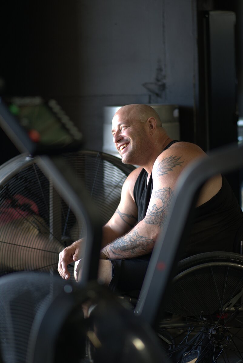 CrossFit Forever member smiling during a group fitness class in Englewood, CO